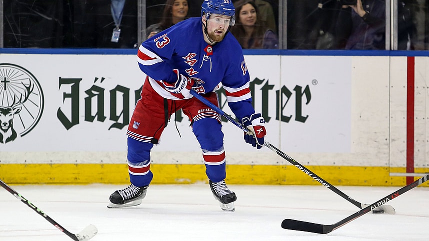 New York Rangers left wing Alexis Lafreniere (13) looks to pass against the Calgary Flames during the third period at Madison Square Garden