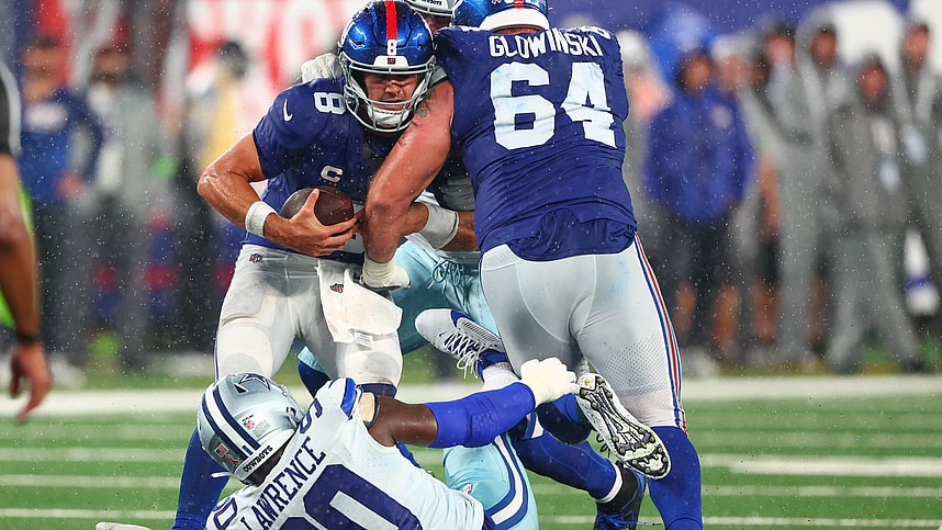 New York Giants quarterback Daniel Jones (8) is sacked by Dallas Cowboys defensive end DeMarcus Lawrence (90) during the second half at MetLife Stadium, Mark Glowinski