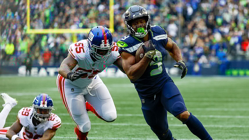 Seattle Seahawks running back Kenneth Walker III (9) escapes a tackle attempt by New York Giants linebacker Jihad Ward (55) to rush for a touchdown during the fourth quarter at Lumen Field