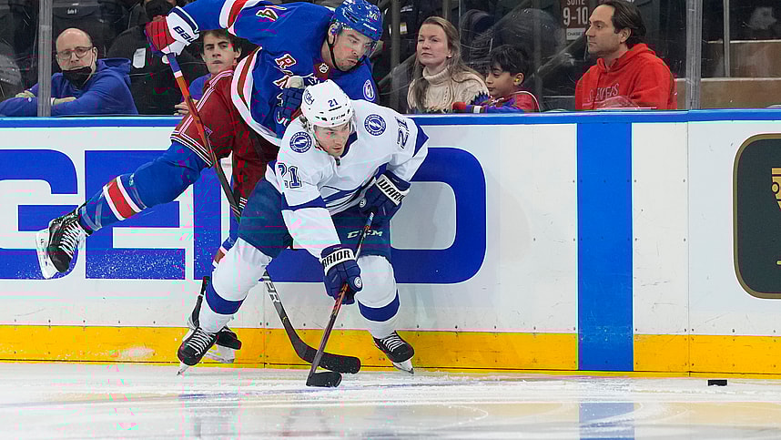 Tampa Bay Lightning center Brayden Point (21) and New York Rangers defenseman Matthew Robertson (44) chase the puck during the third period at Madison Square Garden