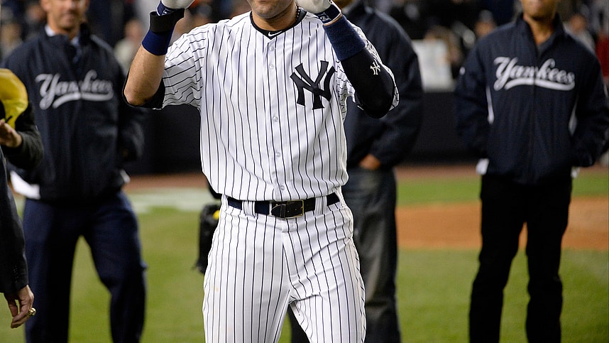 New York Yankees shortstop Derek Jeter (2) reacts with Jorge Posada, Andy Pettitte, and Mariano Rivera after defeating the Baltimore Orioles at Yankee Stadium