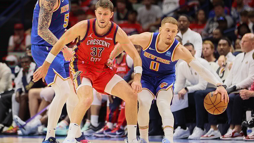 New Orleans Pelicans forward Matt Ryan (37) tries to steal the ball from New York Knicks guard Donte DiVincenzo (0) in the third quarter at Smoothie King Center