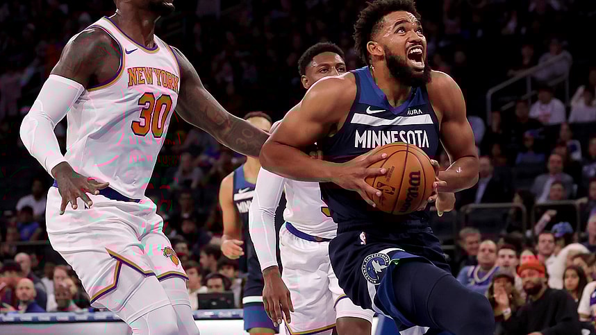 Minnesota Timberwolves center Karl-Anthony Towns (32) drives to the basket against New York Knicks forward Julius Randle (30) and guard RJ Barrett (9) during the first quarter at Madison Square Garden