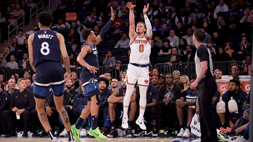 New York Knicks guard Donte DiVincenzo (0) three point shot against Minnesota Timberwolves guard Wendell Moore Jr. (7) and forward Josh Minott (8) during the fourth quarter at Madison Square Garden