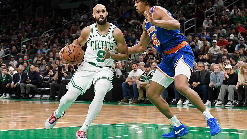 Boston Celtics guard Derrick White (9) controls the ball while New York Knicks center Jericho Sims (45) defends during the first half at TD Garden