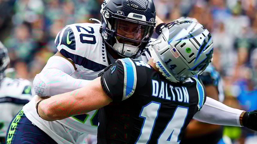 Seattle Seahawks safety Julian Love (20) hits Carolina Panthers quarterback Andy Dalton (14) following a pass attempt by Dalton during the first quarter at Lumen Field, Giants