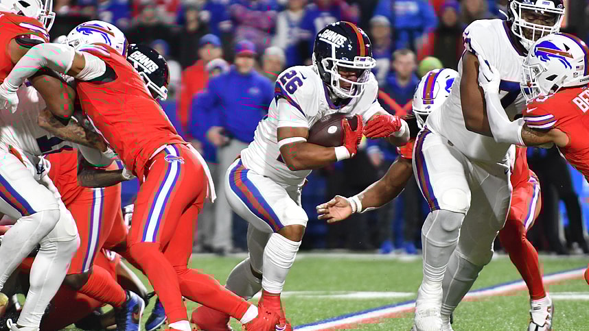 New York Giants running back Saquon Barkley (26) carries the ball against the Buffalo Bills in the second quarter at Highmark Stadium