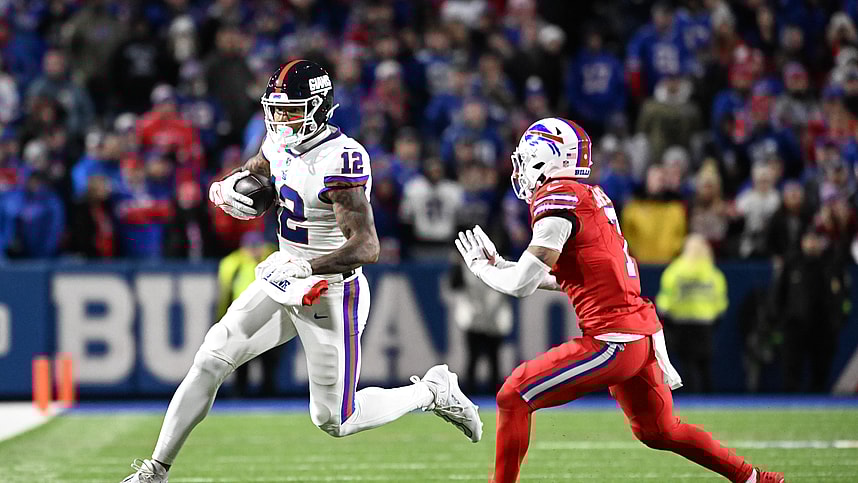 New York Giants tight end Darren Waller (12) gets out of bounds before being hit by Buffalo Bills cornerback Taron Johnson (7) in the fourth quarter at Highmark Stadium