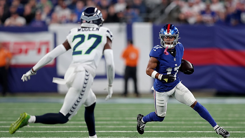 New York Giants wide receiver Wan'Dale Robinson (17) runs with the ball against Seattle Seahawks cornerback Riq Woolen (27) during the first quarter at MetLife Stadium