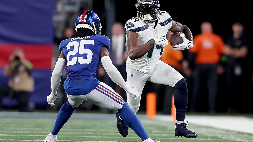 Seattle Seahawks wide receiver DK Metcalf (14) runs with the ball against New York Giants cornerback Deonte Banks (25) during the second quarter at MetLife Stadium