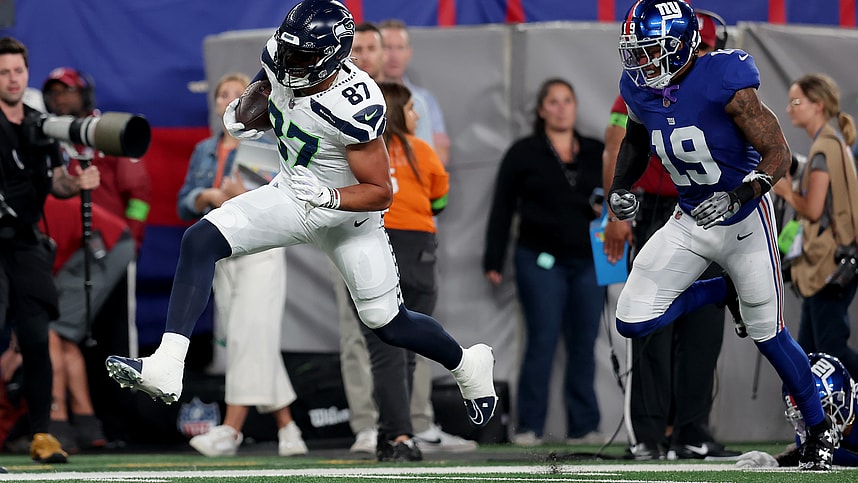 Seattle Seahawks tight end Noah Fant (87) runs with the ball against New York Giants safety Isaiah Simmons (19) during the second quarter at MetLife Stadium