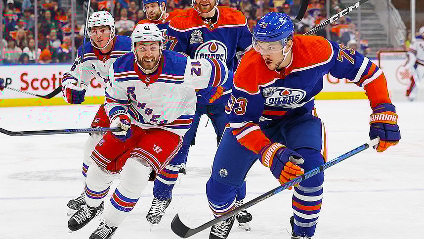 Edmonton Oilers defensemen Vincent Desharnais (73) and New York Rangers forward Barclay Goodrow (21) chase a loos puck during the second period at Rogers Place