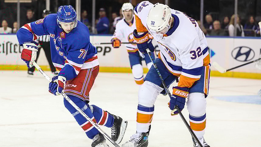 New York Rangers left wing Brennan Othmann (78) and New York Islanders left wing Ross Johnston (32) battle for control of the puck in the third period at Madison Square Garden