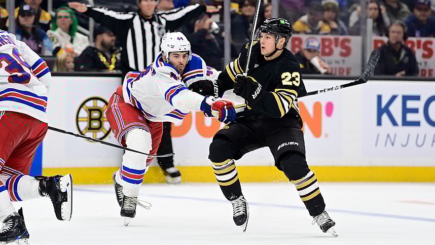 New York Rangers defenseman Matthew Robertson (44) checks Boston Bruins right wing Fabian Lysell (23) during the third period at TD Garden.