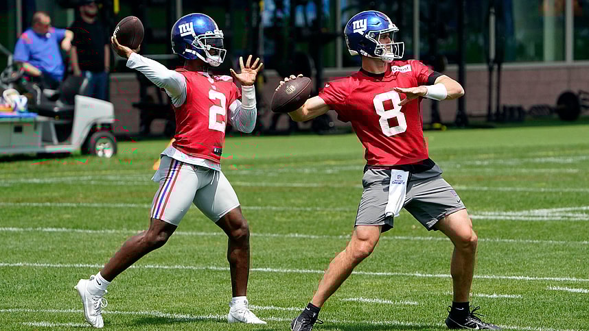 New York Giants quarterbacks Daniel Jones (8) and Tyrod Taylor (2) throw the ball on the first day of mandatory minicamp at the Giants training center in East Rutherford