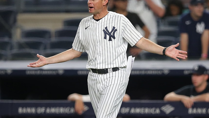 New York Yankees bench coach Carlos Mendoza (64) reacts after being ejected during the tenth inning against the Boston Red Sox at Yankee Stadium (Mets)