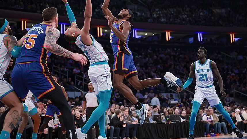 New York Knicks guard Immanuel Quickley (5) drives to the basket as Charlotte Hornets guard Bryce McGowens (7) defends during the first half at Madison Square Garden
