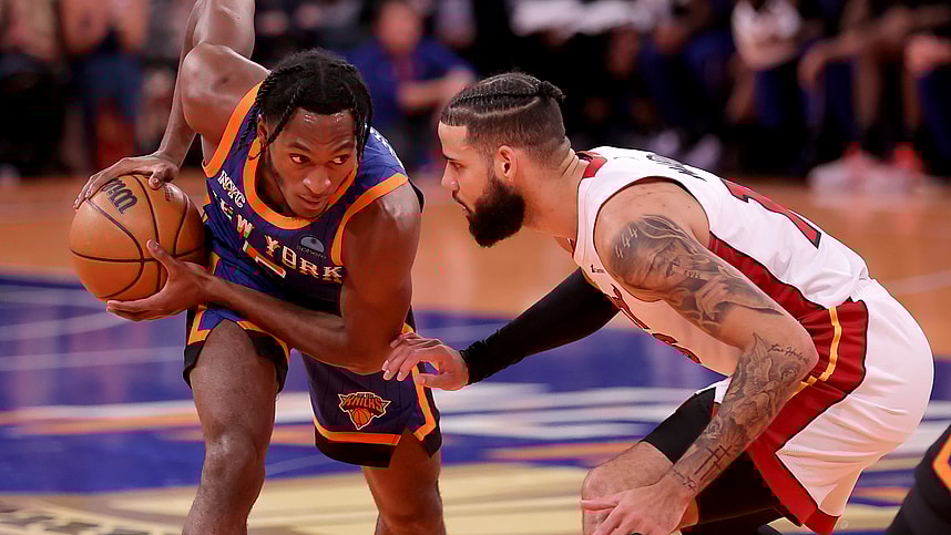 New York Knicks guard Immanuel Quickley (5) controls the ball against Miami Heat forward Caleb Martin (16) during the fourth quarter at Madison Square Garden
