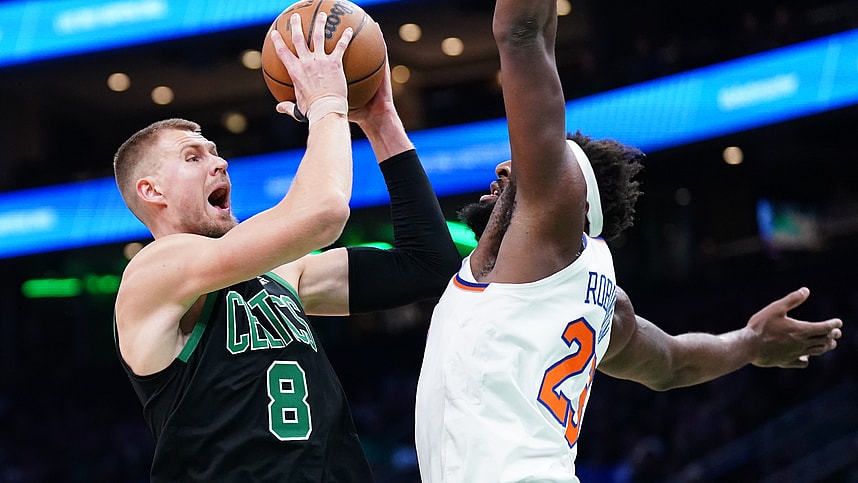 Boston Celtics center Kristaps Porzingis (8) shoots against New York Knicks center Mitchell Robinson (23) in the first quarter at TD Garden