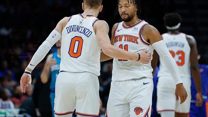 New York Knicks guard Jalen Brunson (11) embraces guard Donte DiVincenzo (0) during the first quarter against the Charlotte Hornets at Spectrum Center