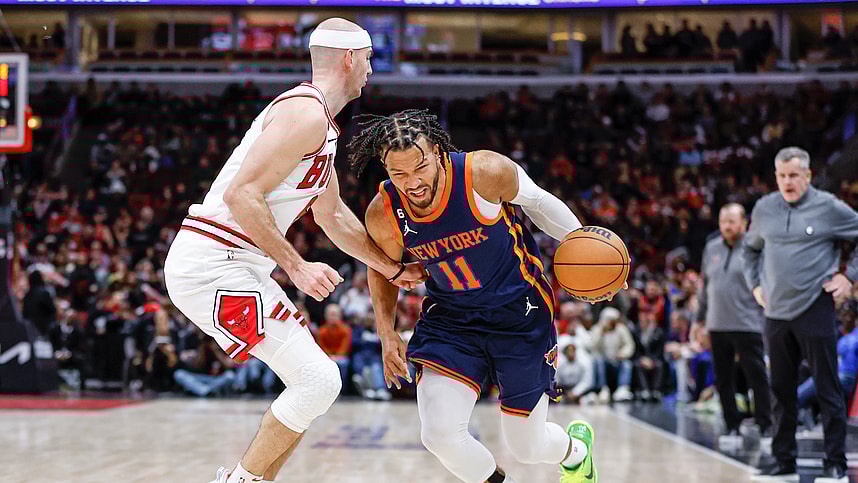 New York Knicks guard Jalen Brunson (11) drives to the basket against Chicago Bulls guard Alex Caruso (6) during overtime at United Center