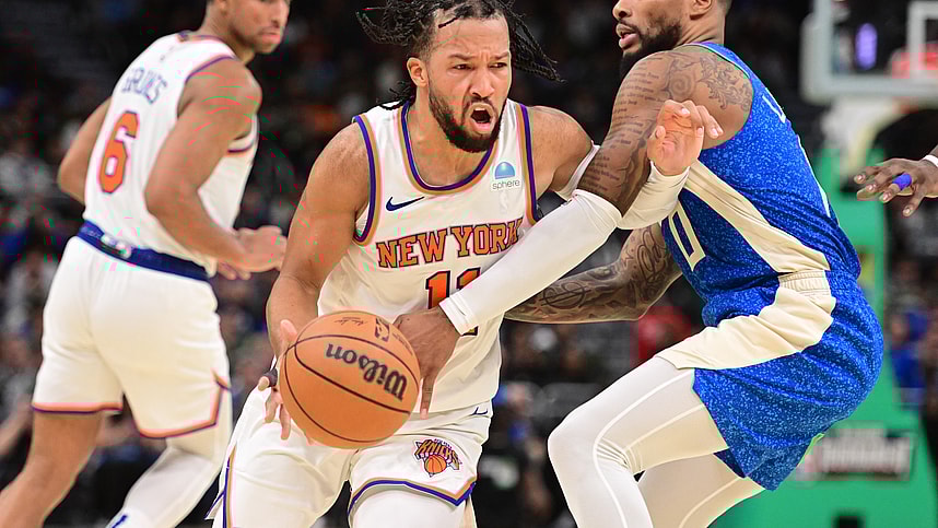 New York Knicks guard Jalen Brunson (11) drives for the basket against Milwaukee Bucks guard Damian Lillard (0) in the fourth quarter at Fiserv Forum