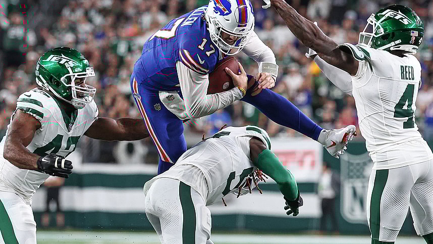East Rutherford, New Jersey, USA; Buffalo Bills quarterback Josh Allen (17) rushes the ball as New York Jets linebacker C.J. Mosley (57) and cornerback D.J. Reed (4) and defensive end Bryce Huff (47) defend during the first half at MetLife Stadium