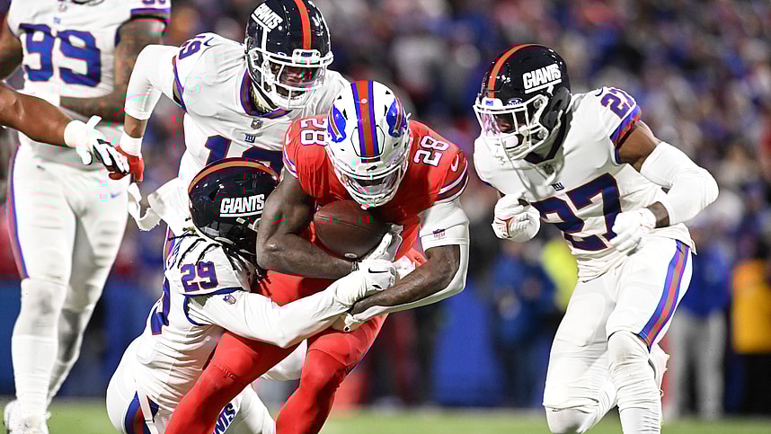 Buffalo Bills running back Latavius Murray (28) is tackled by New York Giants safety Xavier McKinney (29) and safety Jason Pinnock (27) in the second quarter at Highmark Stadium