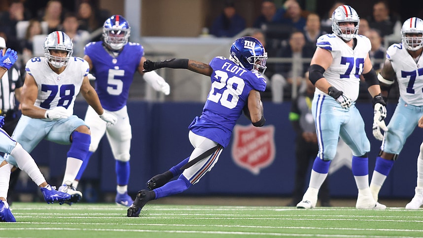 New York Giants cornerback Cor'Dale Flott (28) runs with the ball after making an interception in the first quarter against the Dallas Cowboys at AT&T Stadium