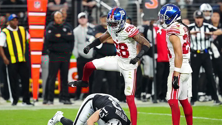 New York Giants cornerback Cor'Dale Flott (28) celebrates after breaking up a reception attempt by Las Vegas Raiders wide receiver Hunter Renfrow (13) during the fourth quarter at Allegiant Stadium