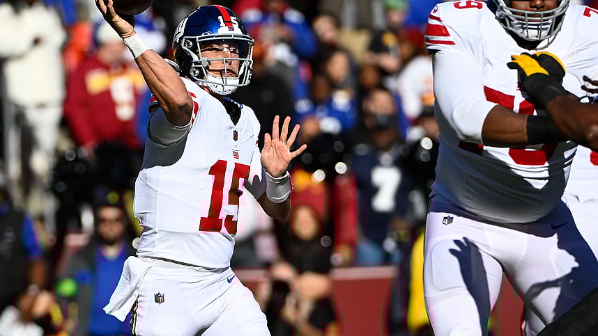New York Giants quarterback Tommy DeVito (15) attempts a pass against the Washington Commanders during the first half at FedExField