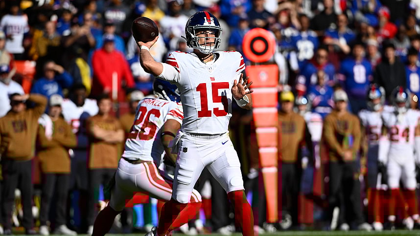 New York Giants quarterback Tommy DeVito (15) attempts a pass against the Washington Commanders during the first half at FedExField
