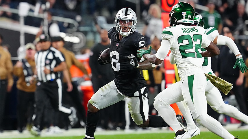 Las Vegas Raiders running back Josh Jacobs (8) runs ahead of New York Jets safety Tony Adams (22) during the third quarter at Allegiant Stadium