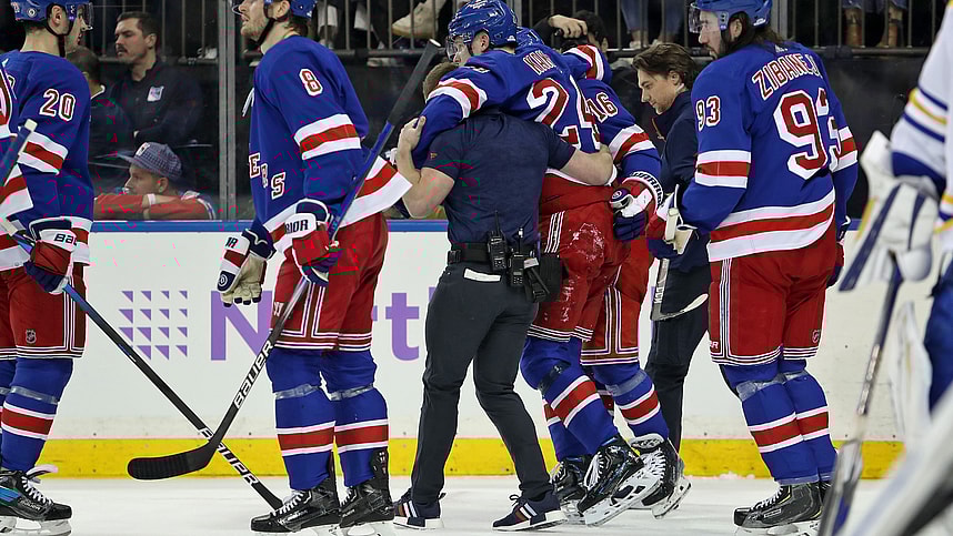 New York Rangers right wing Kaapo Kakko (24) is helped by a trainer on the ice after an injury to his left leg during the second period against the Buffalo Sabres at Madison Square Garden