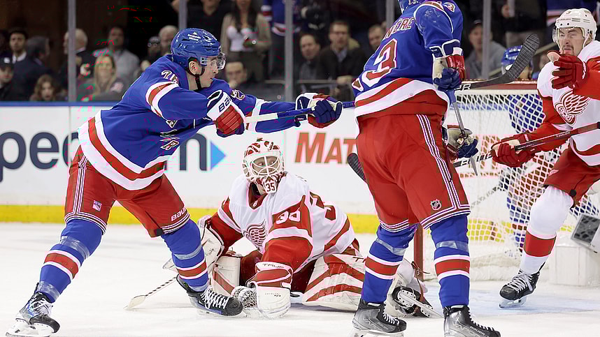 New York Rangers left wing Jimmy Vesey (26) scores the game winning goal against Detroit Red Wings goaltender Ville Husso (35) and defenseman Justin Holl (3) during the third period at Madison Square Garden