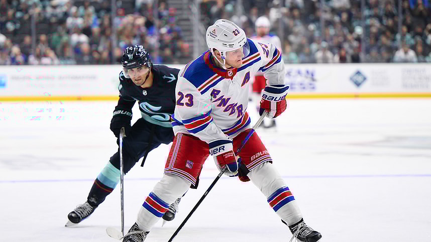 New York Rangers defenseman Adam Fox (23) plays the puck during the third period against the New York Rangers at Climate Pledge Arena