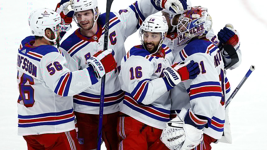 New York Rangers players celebrate their overtime win against the Winnipeg Jets at Canada Life Centre
