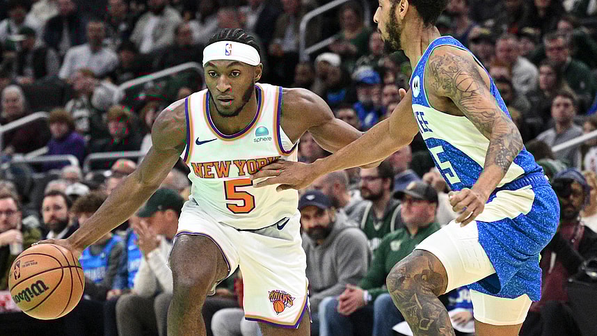 New York Knicks guard Immanuel Quickley (5) drives to the basket against Milwaukee Bucks guard Cameron Payne (15) in the first half at Fiserv Forum