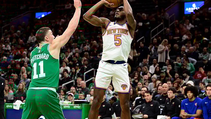 New York Knicks guard Immanuel Quickley (5) shoots over Boston Celtics guard Payton Pritchard (11) during the first half at TD Garden