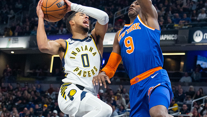 Indiana Pacers guard Tyrese Haliburton (0) shoots the ball while New York Knicks guard RJ Barrett (9) defends in the second half at Gainbridge Fieldhouse