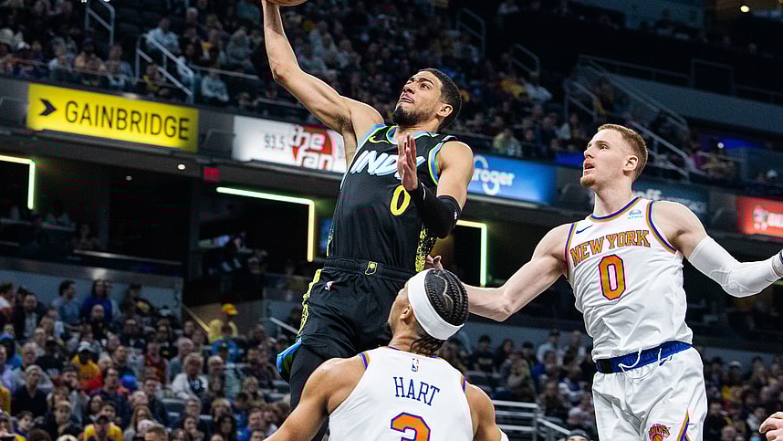 Indiana Pacers guard Tyrese Haliburton (0) shoots the ball while New York Knicks guard Donte DiVincenzo (0) defends in the first quarter at Gainbridge Fieldhouse