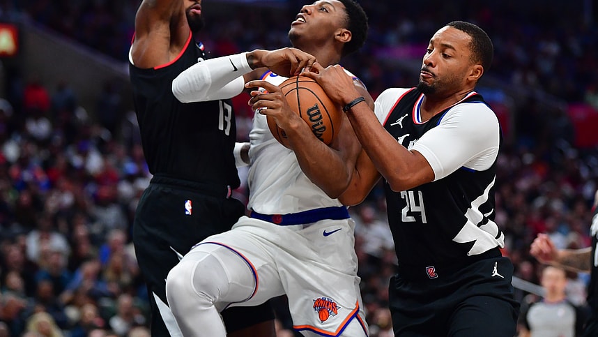 Los Angeles Clippers forward Paul George (13) and guard Norman Powell (24) defend against New York Knicks guard RJ Barrett (9) during the second half at Crypto.com Arena