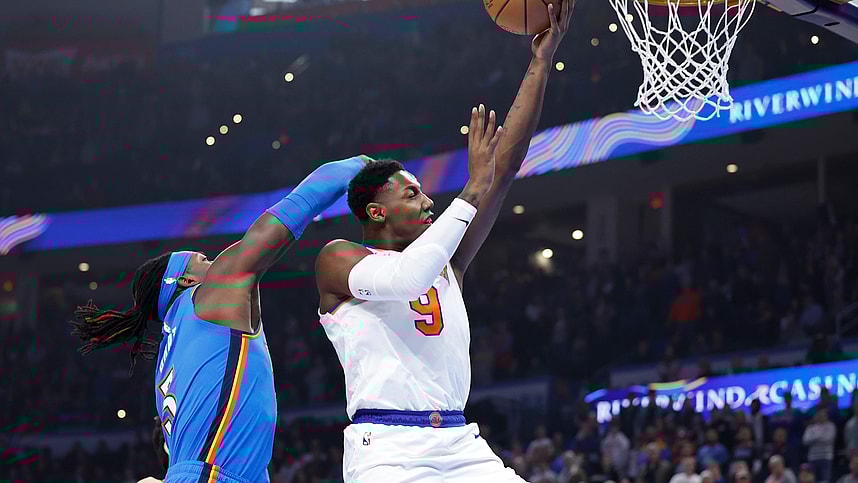 New York Knicks guard RJ Barrett (9) is fouled by Oklahoma City Thunder guard Shai Gilgeous-Alexander (2) on the way to the basket during the first quarter at Paycom Center