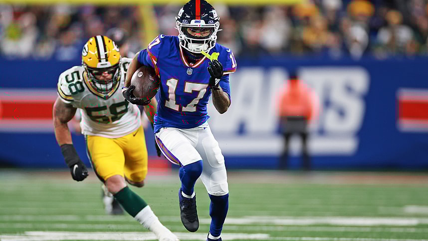 New York Giants wide receiver Wan'Dale Robinson (17) scrambles with the ball as Green Bay Packers linebacker Isaiah McDuffie (58) defends during the second quarter at MetLife Stadium