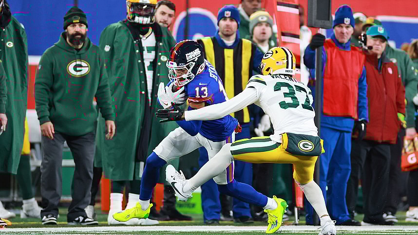New York Giants wide receiver Jalin Hyatt (13) runs the ball as Green Bay Packers cornerback Carrington Valentine (37) defends during the second quarter at MetLife Stadium