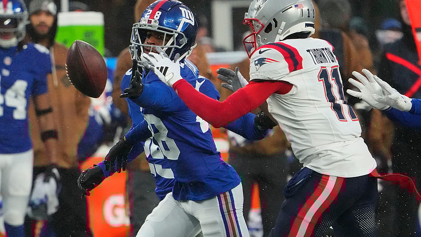 New York Giants cornerback Cor'Dale Flott (28) and New England Patriots wide receiver Tyquan Thornton (11) fight for the ball in the 2nd half at MetLife Stadium
