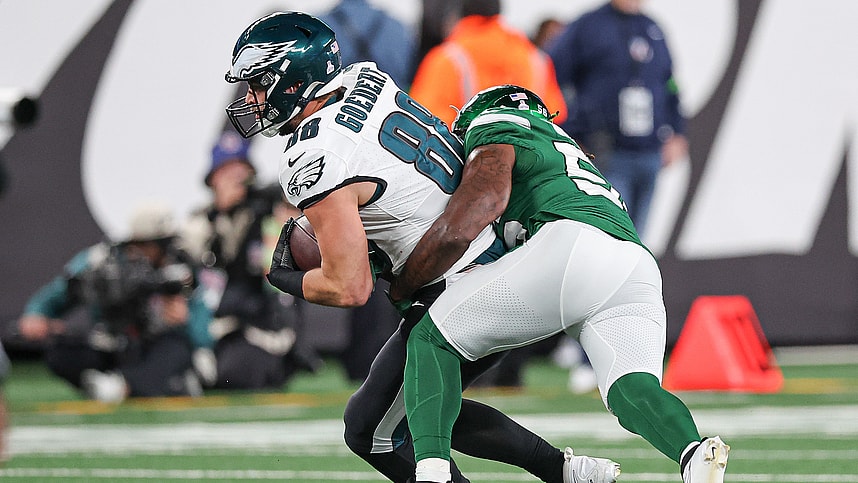 Philadelphia Eagles tight end Dallas Goedert (88) fights for yards as New York Jets linebacker Quincy Williams (56) tackles during the second half at MetLife Stadium.