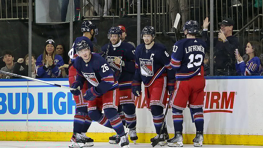 New York Rangers left wing Jimmy Vesey (26) celebrates his goal with center Nick Bonino (12), forward Alexis Lafreniere (13), defenseman K'Andre Miller (79) and defenseman Jacob Trouba (8) during the second period against the Los Angeles Kings at Madison Square Garden