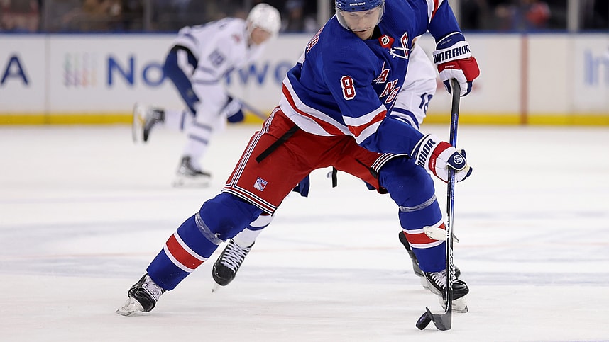 New York Rangers defenseman Jacob Trouba (8) plays the puck against Toronto Maple Leafs center Noah Gregor (18) during the first period at Madison Square Garden