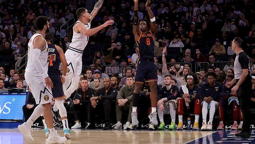 New York Knicks forward OG Anunoby (8) shoots a three point shot against Denver Nuggets forward Michael Porter Jr. (1) and Denver Nuggets guard Jamal Murray (27) during the third quarter at Madison Square Garden